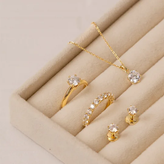 Engagement ring with matching wedding band, earrings and pendant