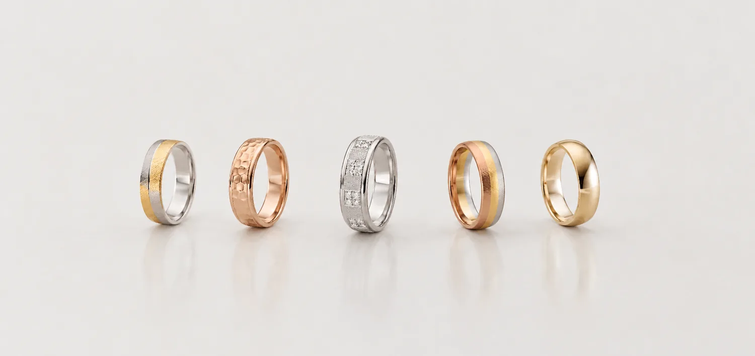 Five RAUSCHMAYER men's wedding bands in yellow, rose and white gold with diamonds