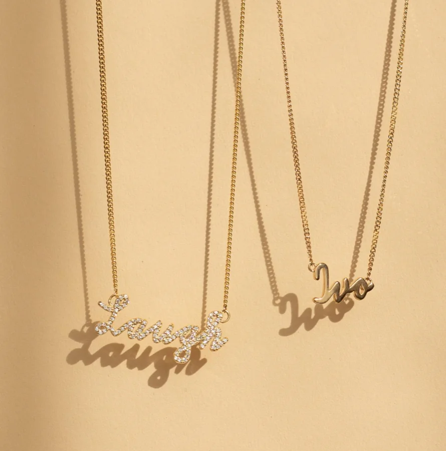 RAUSCHMAYER personalized script necklaces in gold — custom name jewelry from the Red Bank Design Studio