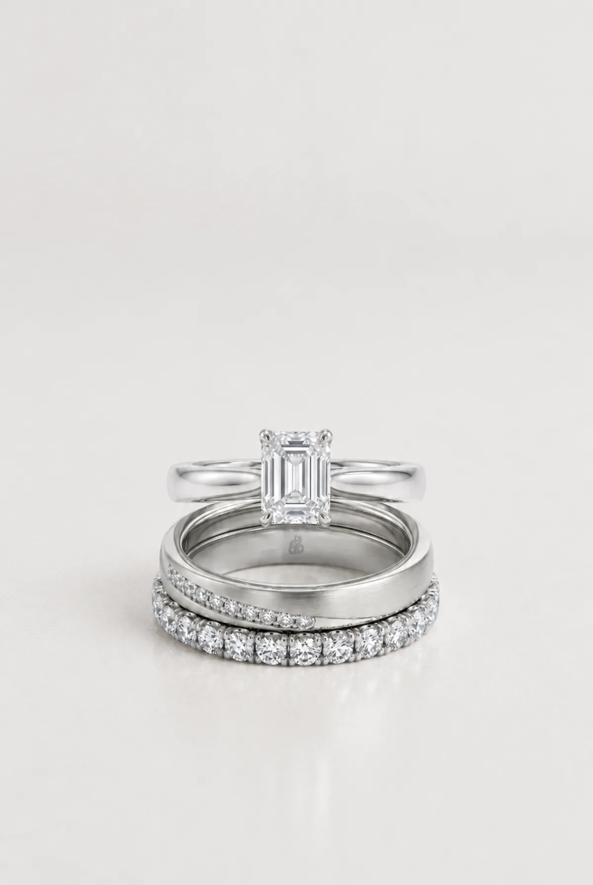 The complete RAUSCHMAYER bridal set — engagement ring, wedding band and eternity band in platinum